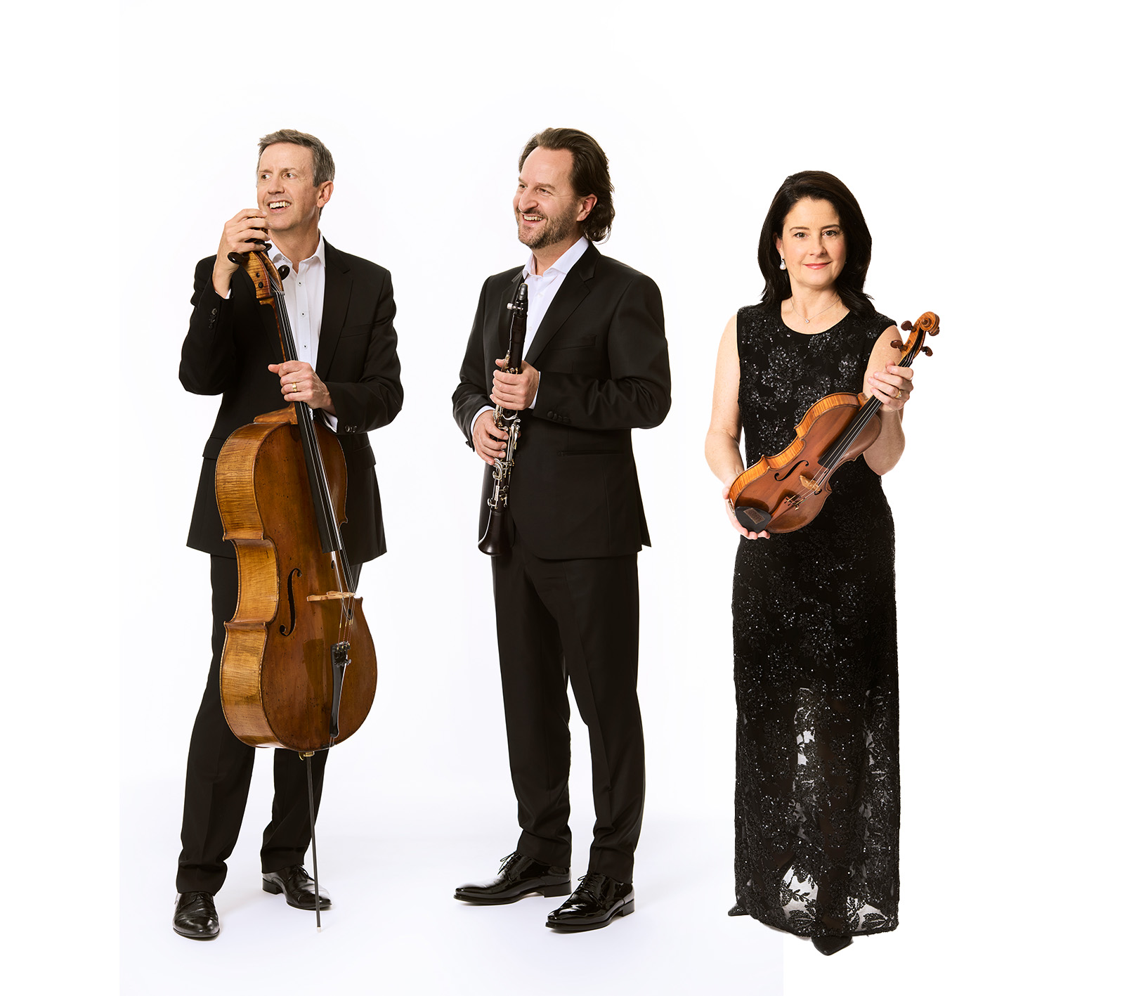 Three members of the Australia Ensemble stand with their instruments